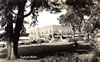 City - 1940's: Main Stree from the Courthouse Lawn - Adult Reading the Paper